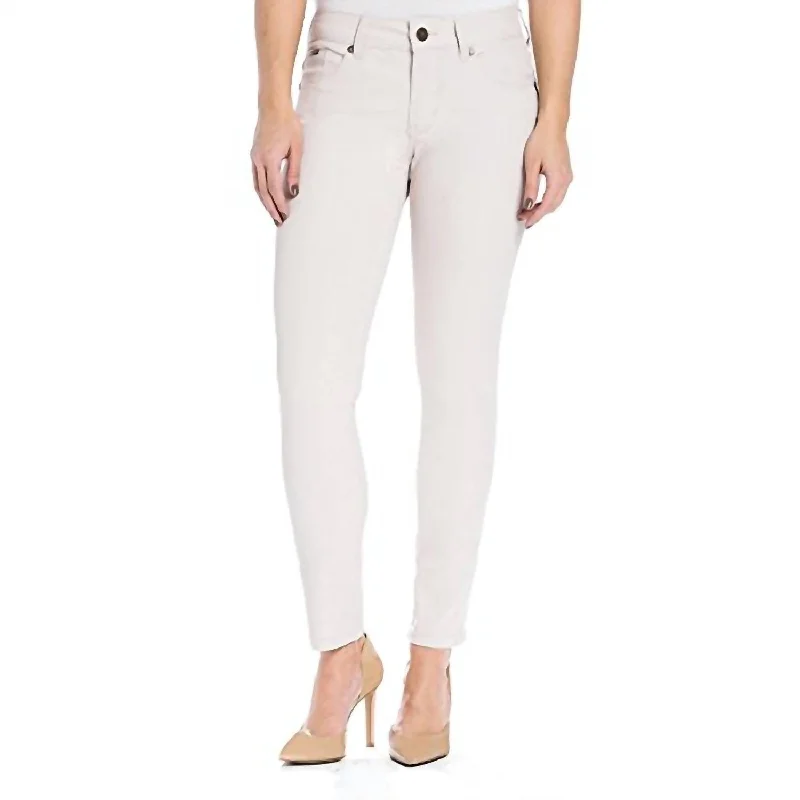 Vintage-inspired tight trousers for women with buttoned waist and retro charm -Audrey Ankle Jeans In Almond